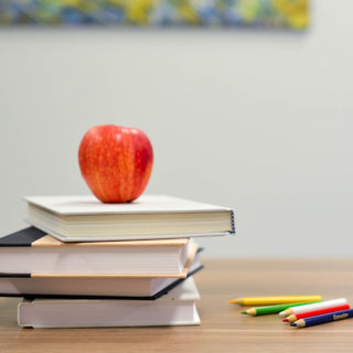 Apple, books, pencils, and blocks