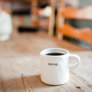 Coffee cup that says Begin